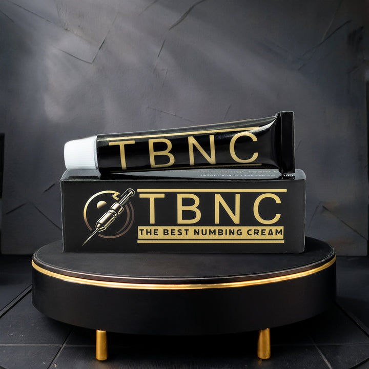 TBNC numbing cream for aesthetic treatment packaging on a black stand with a dark background
