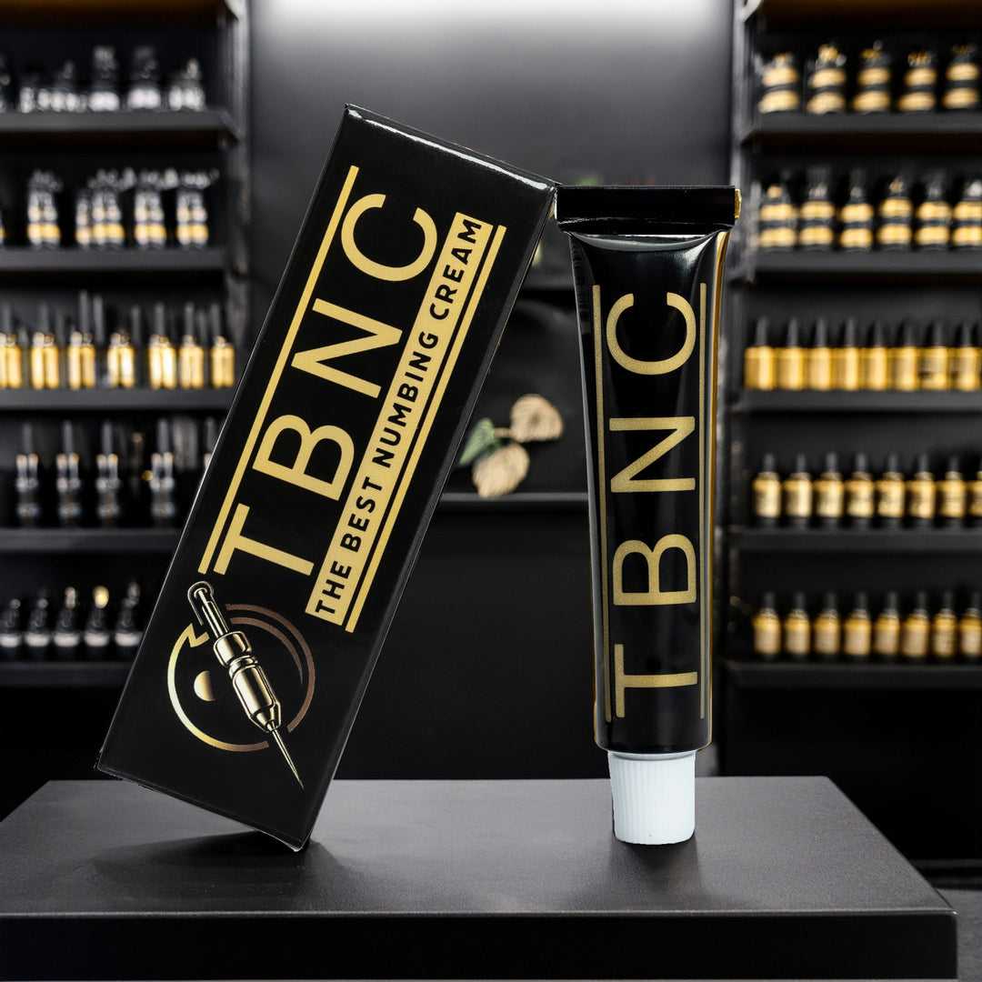 TBNC numbing cream packaging on a black surface with shelves in the background
