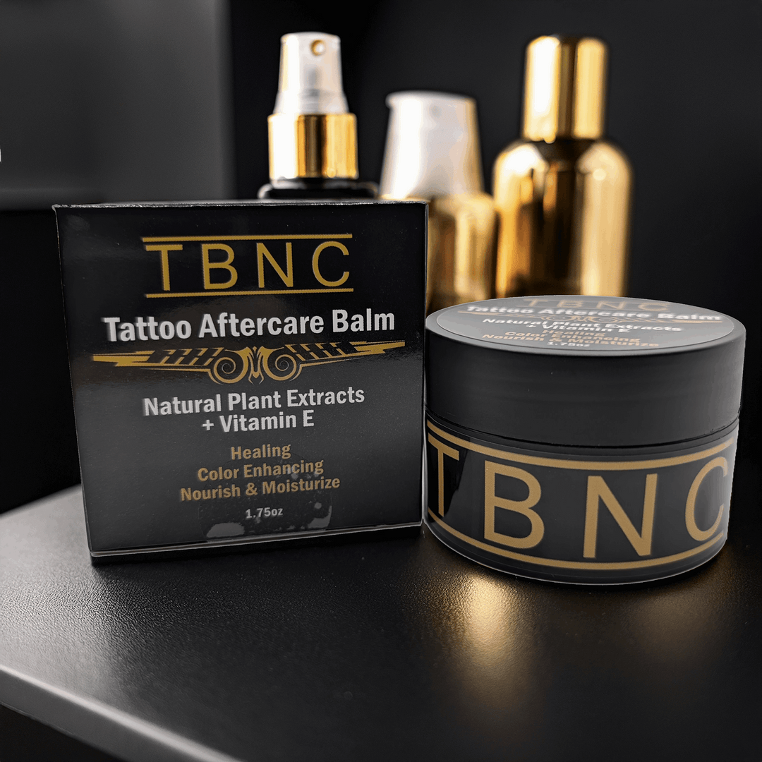 TBNC tattoo aftercare balm packaging on a dark surface