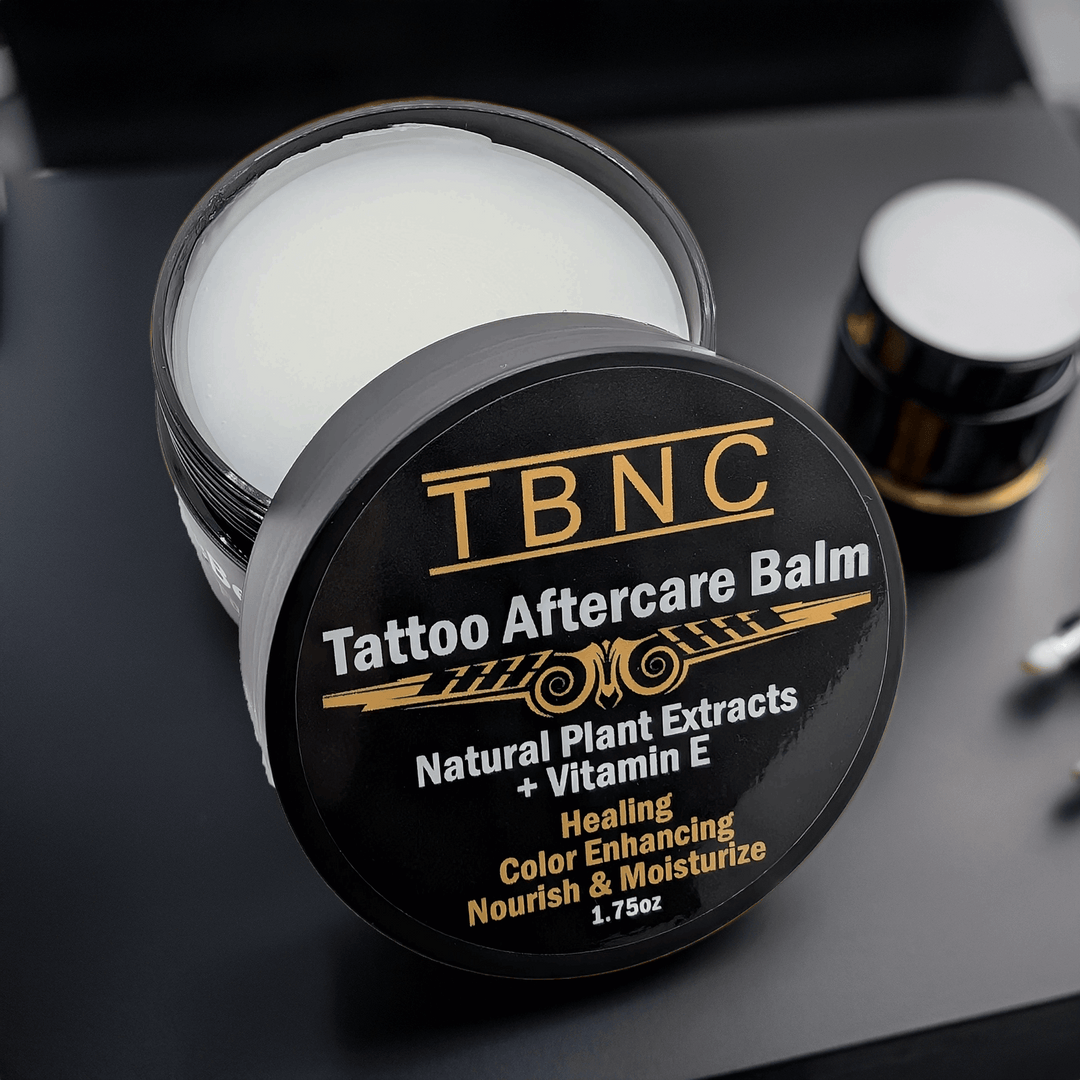TBNC Tattoo Aftercare Balm jar on a dark surface