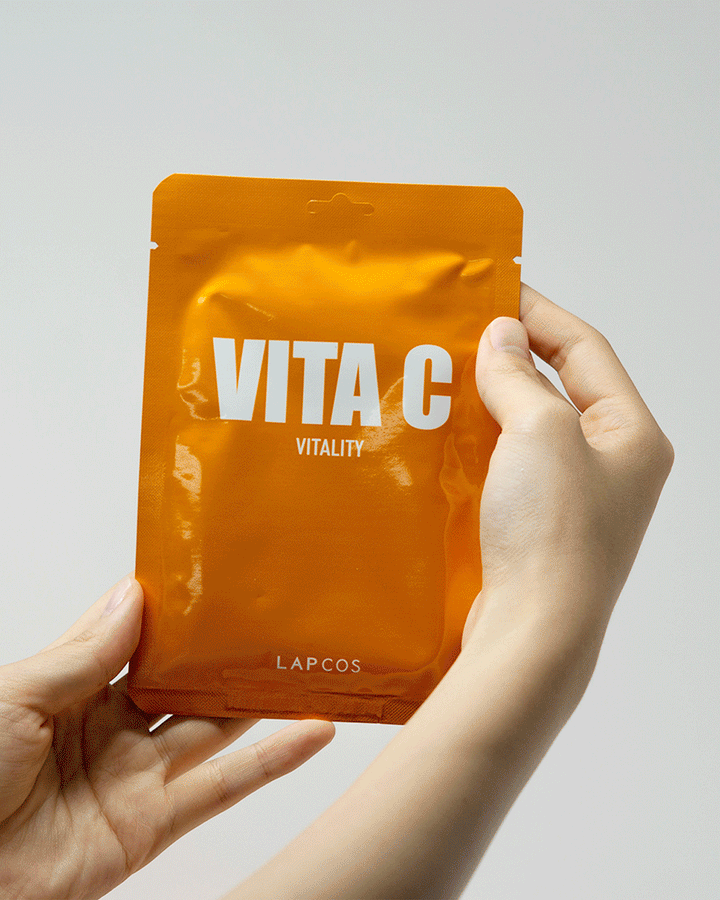 Vitamin C facial mask showing sheet mask o hand