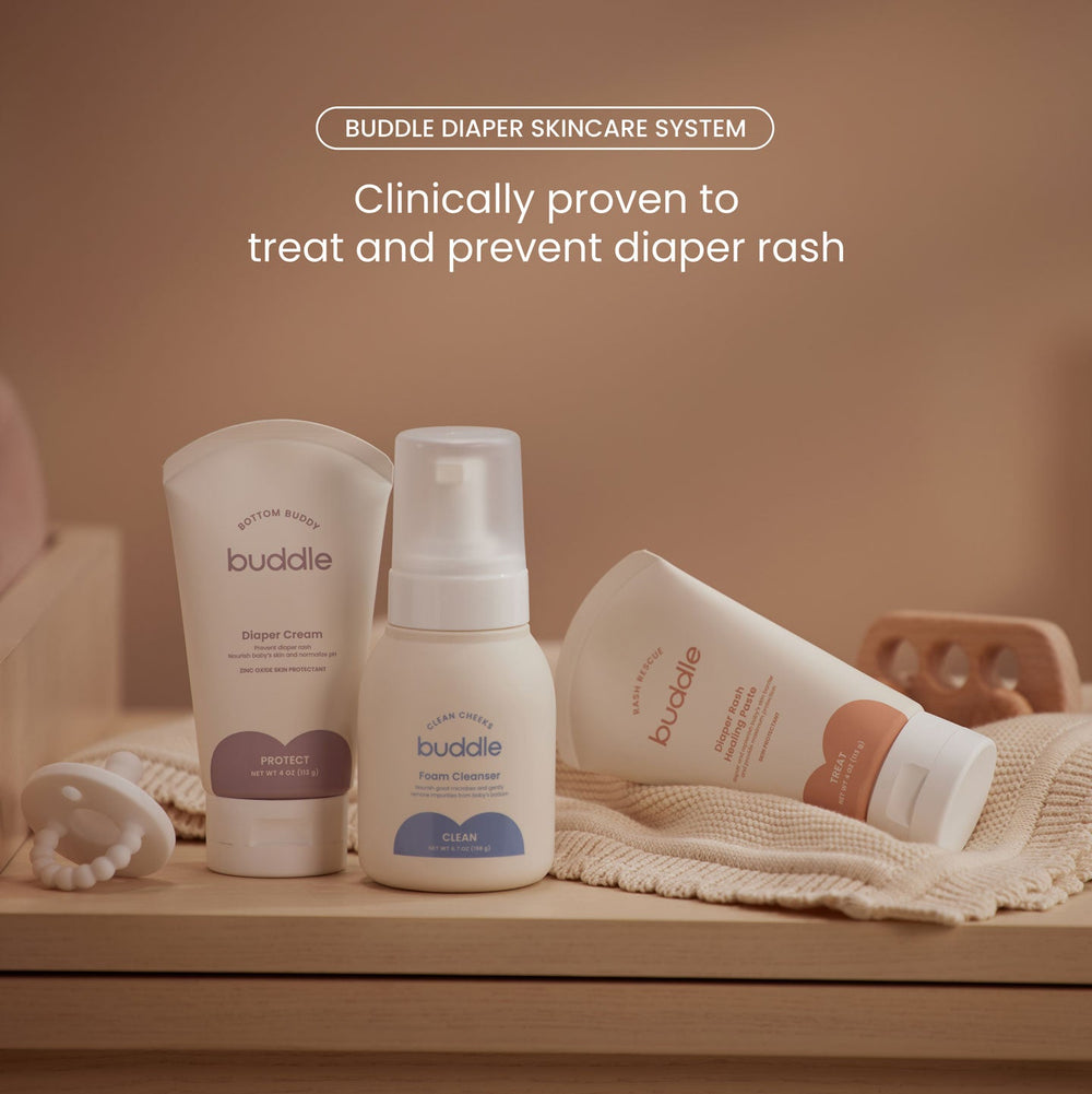 Buddle diaper skincare system on a wooden surface with a neutral background