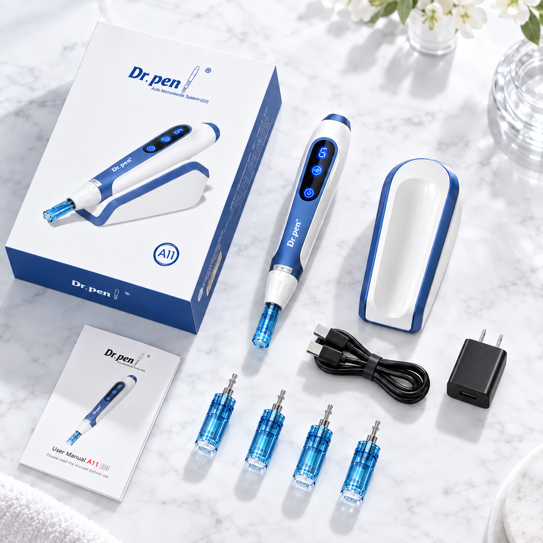 Dr. pen A11  derma pen kit with its white and blue retail box, pen device, charging dock, four blue needle cartridges, USB cable, power adapter, and user manual, arranged on a white marble surface.