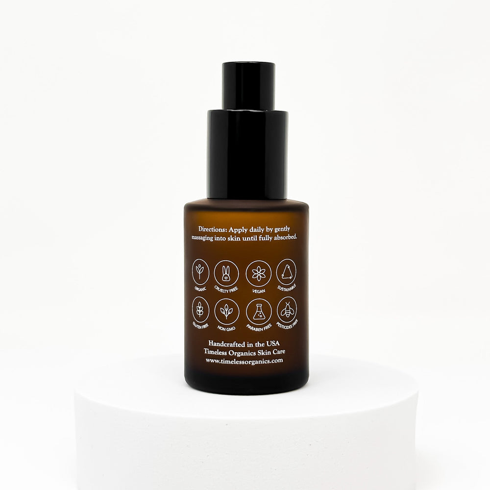 Skincare face serum bottle with black cap and detailed label on a white background