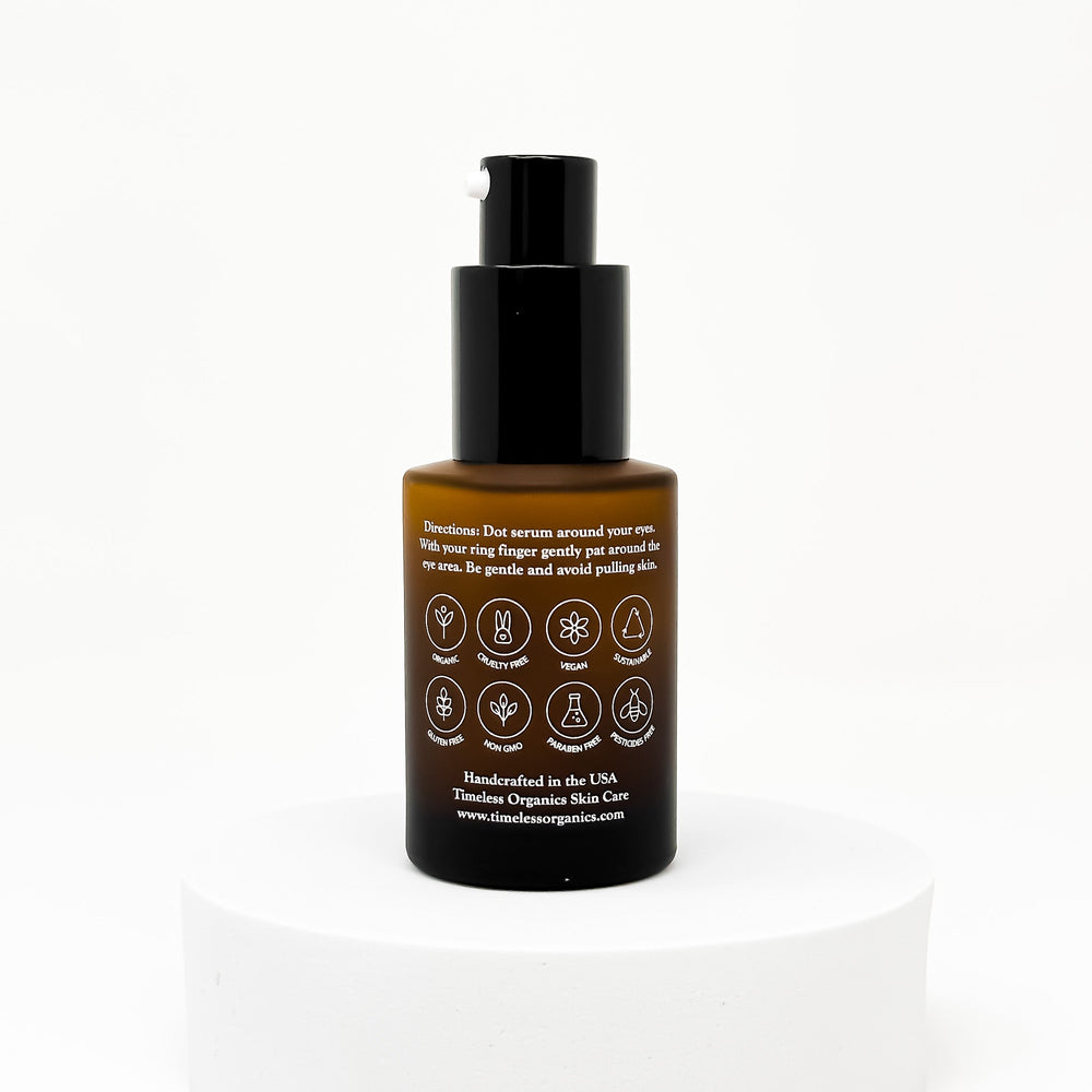 Skincare serum bottle with black cap and brown body on a white background