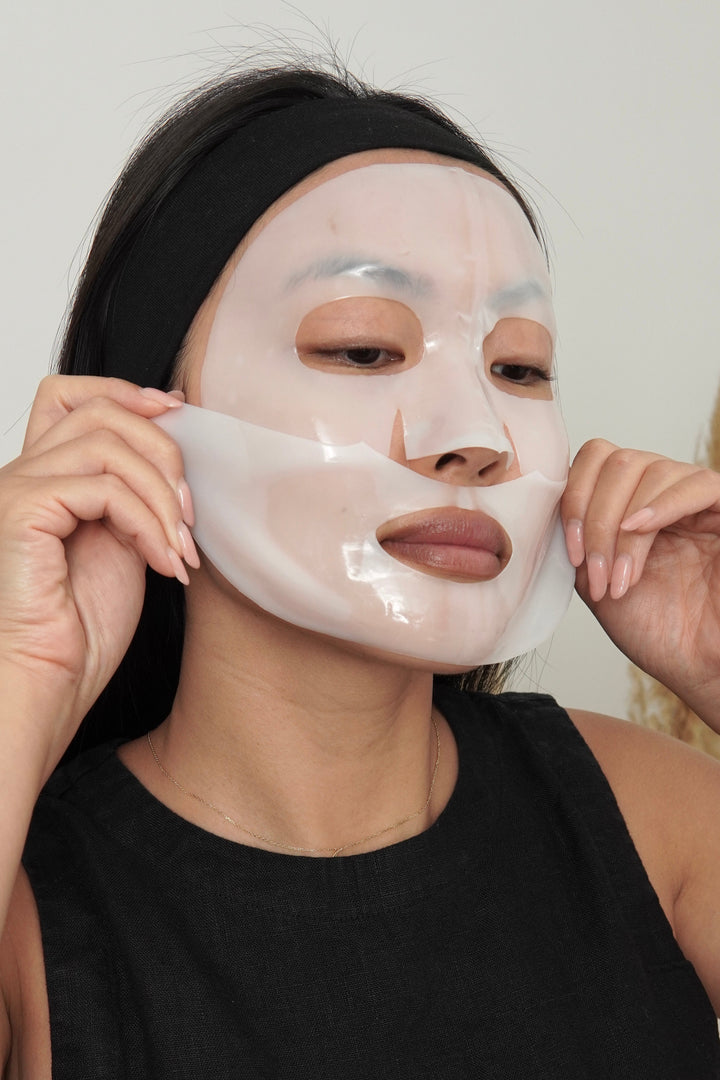 Person wearing a face mask with a neutral background