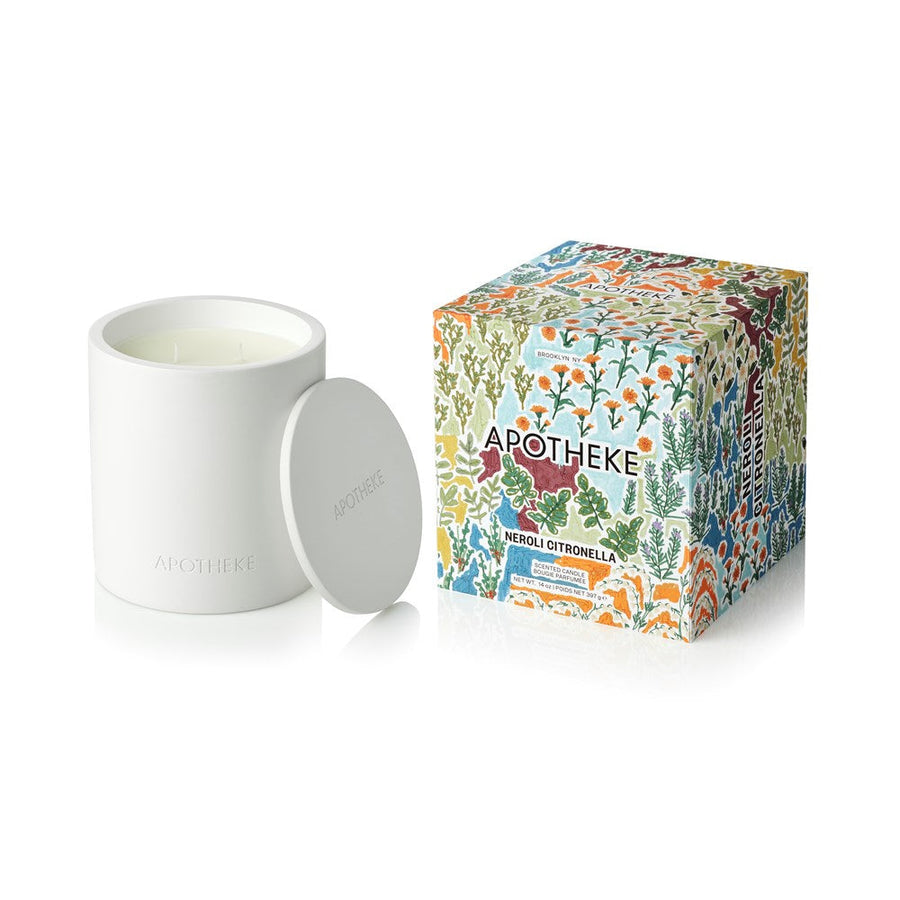 White candle with floral-patterned box labeled 'Apotheke', said Neroli Citronella, on a white background