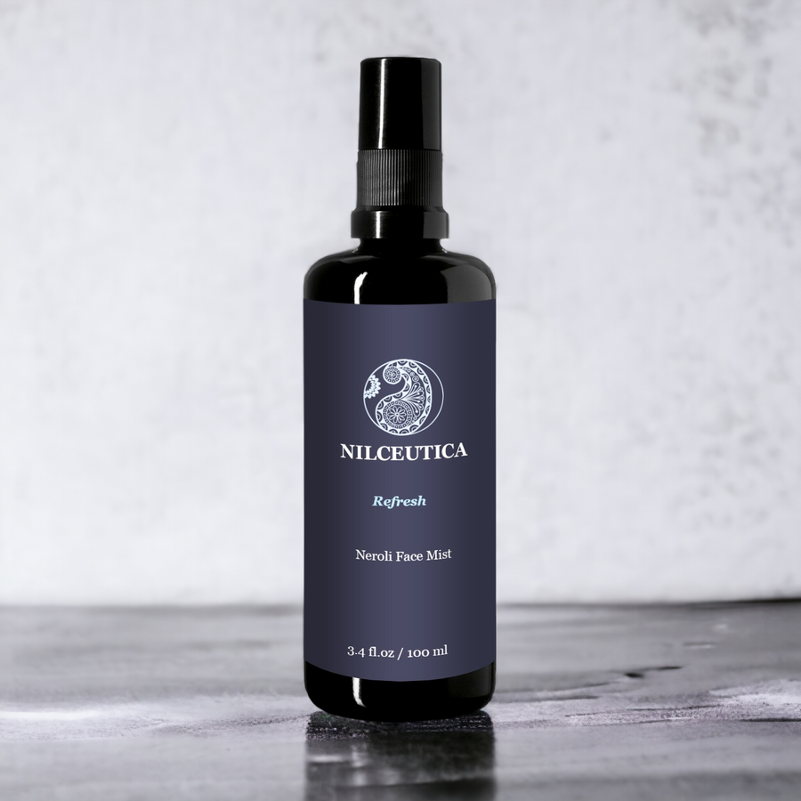 Face toner mist for facial soothing and hydration 3oz black bottle on gray background 
