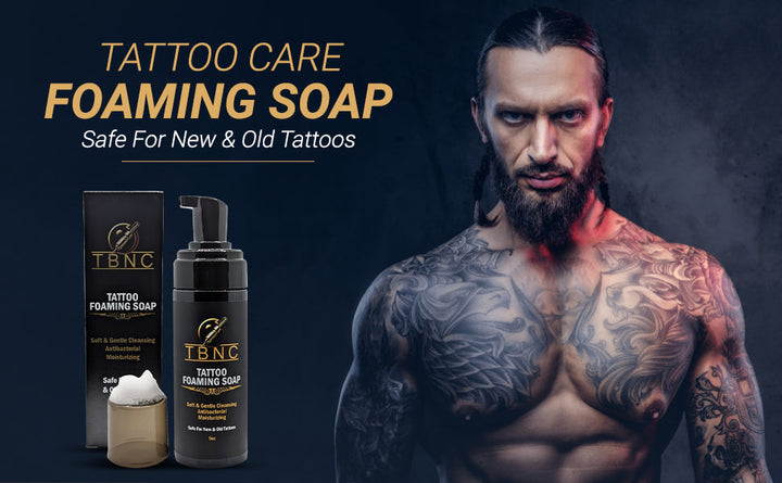 Tattoo and PMU foaming soap on black background, with a men showing body tattoos. 