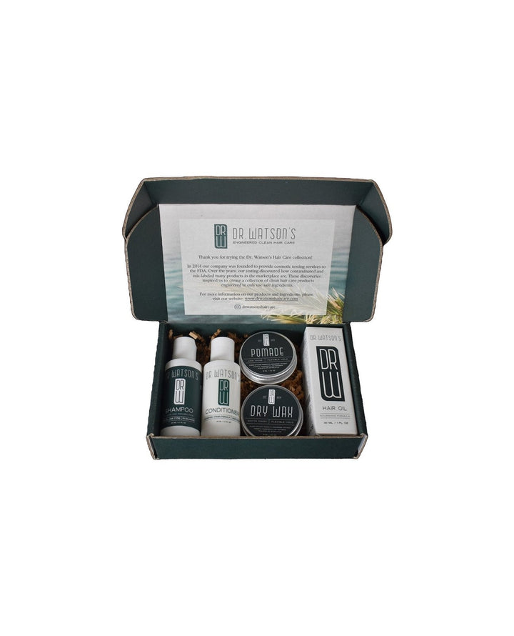 Set of grooming products in a box with visible branding on a white background