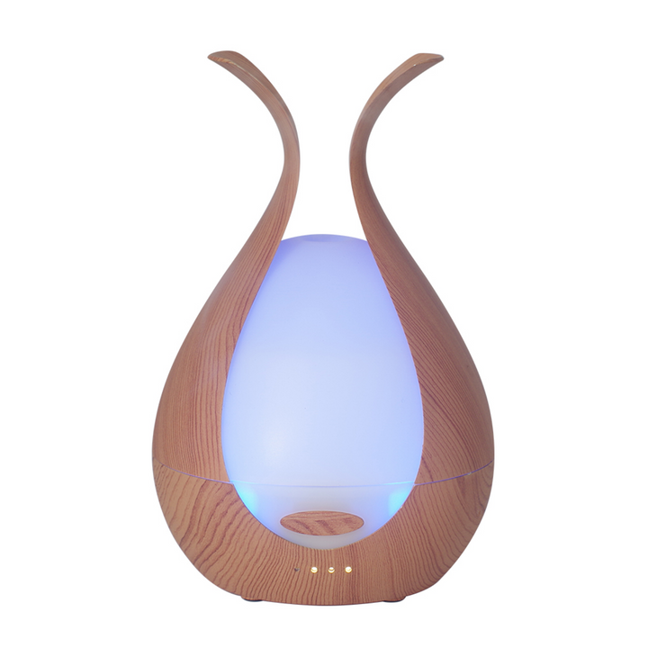 Wooden diffuser with a glowing blue light on a white background
