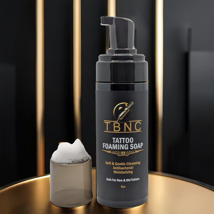 Tattoo and PMU foaming soap on black gold background